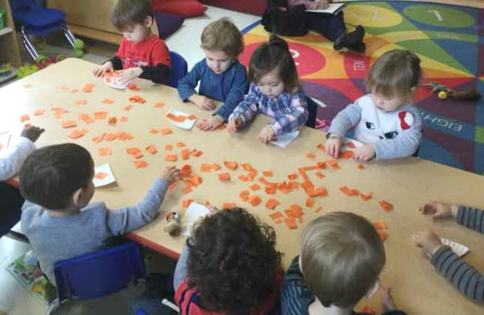 Preschoolers engaged in creative project